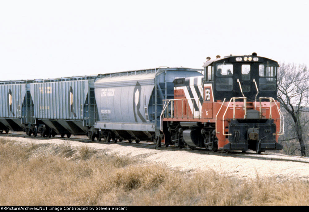 RSS MP15DC #15 head out with some ROCK covered hoppers.